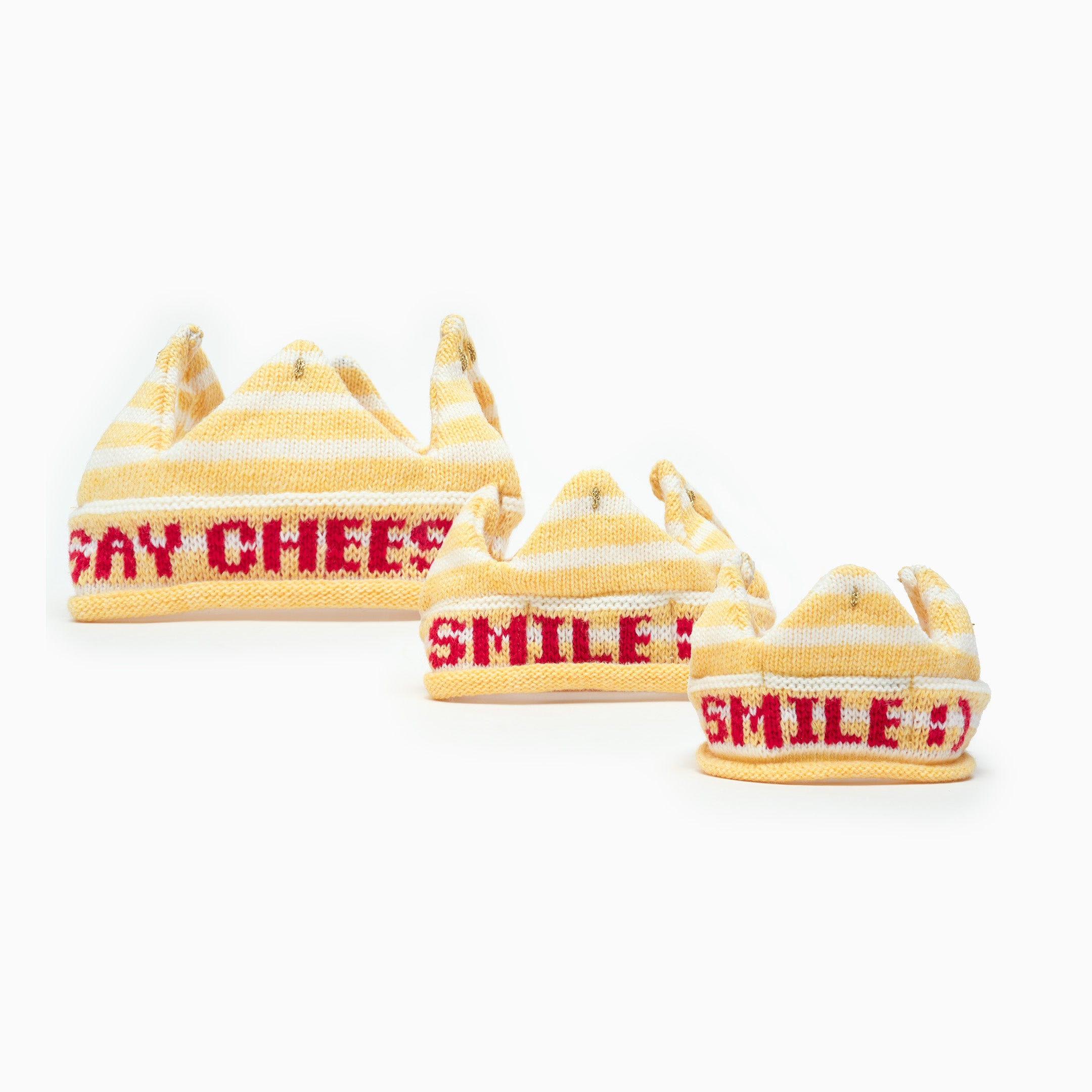 Set of yellow knitted hats with red text on a white background
