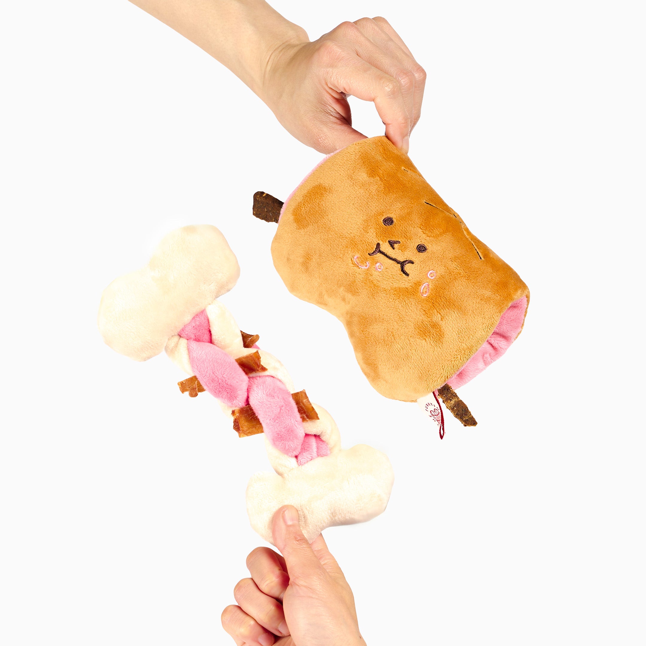 Plush toy resembling a marshmallow with a face, held by two hands against a white background