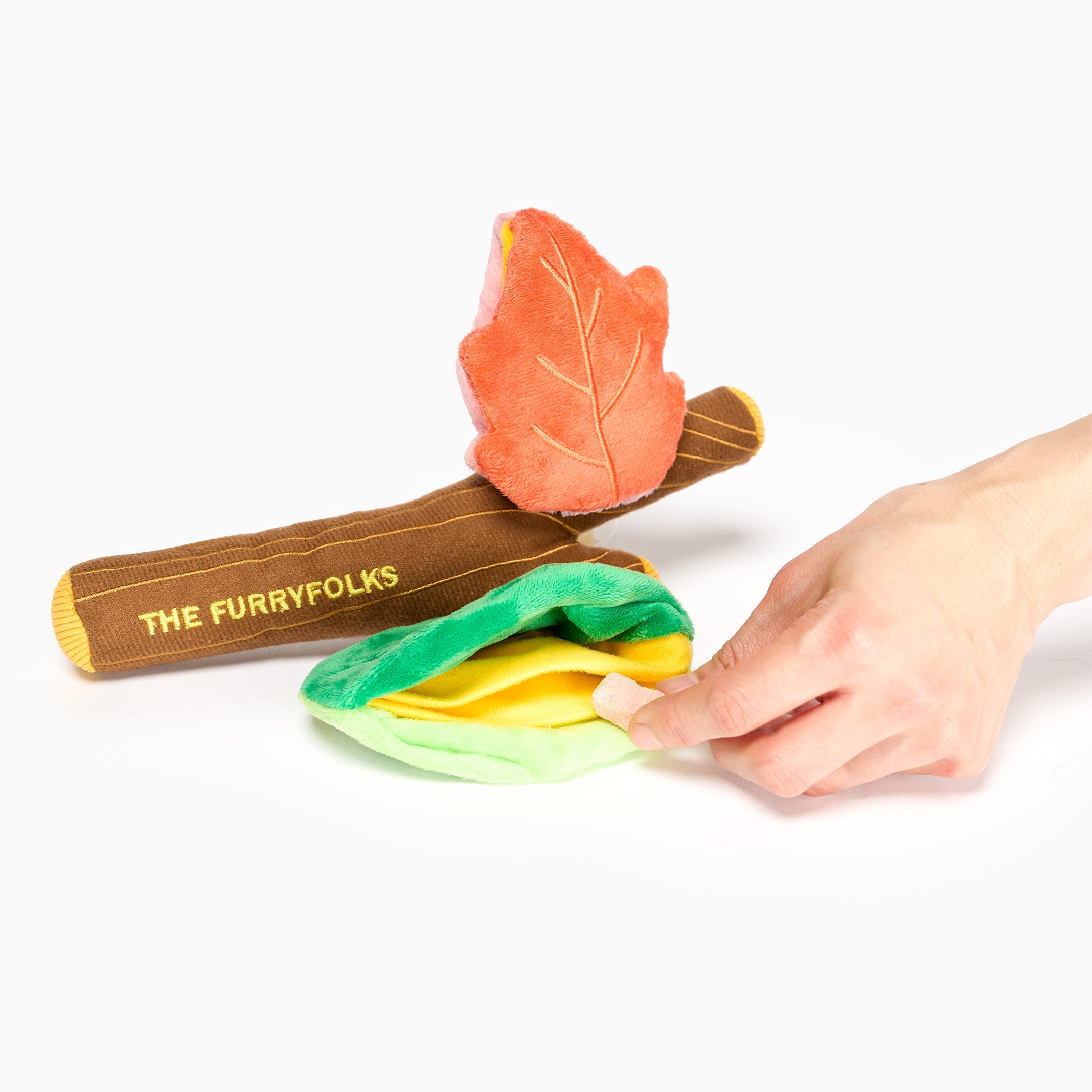 Colorful dog toy with leaf design and 'The Furryfolks' branding on a white background