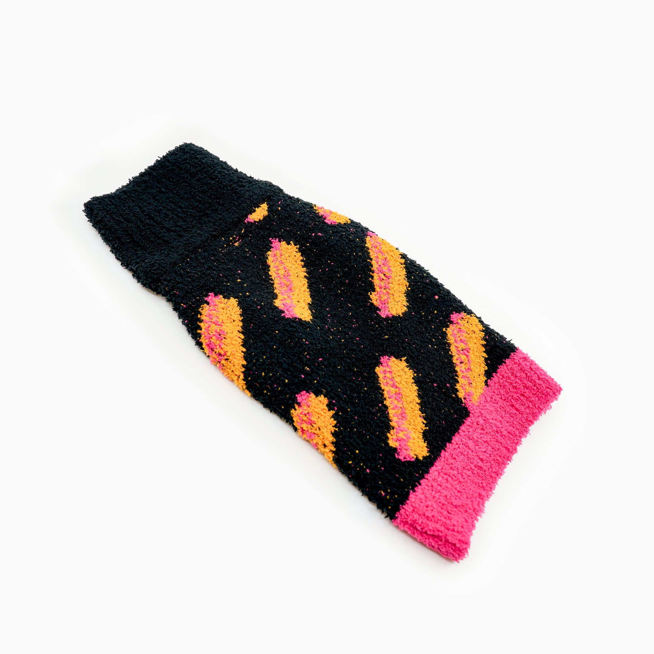 Black knit dog sweater with bright orange and pink hot dog patterns, featuring a contrasting pink hem. This playful and cozy design adds warmth and a fun pop of color, perfect for fashionable furry friends who love unique styles.