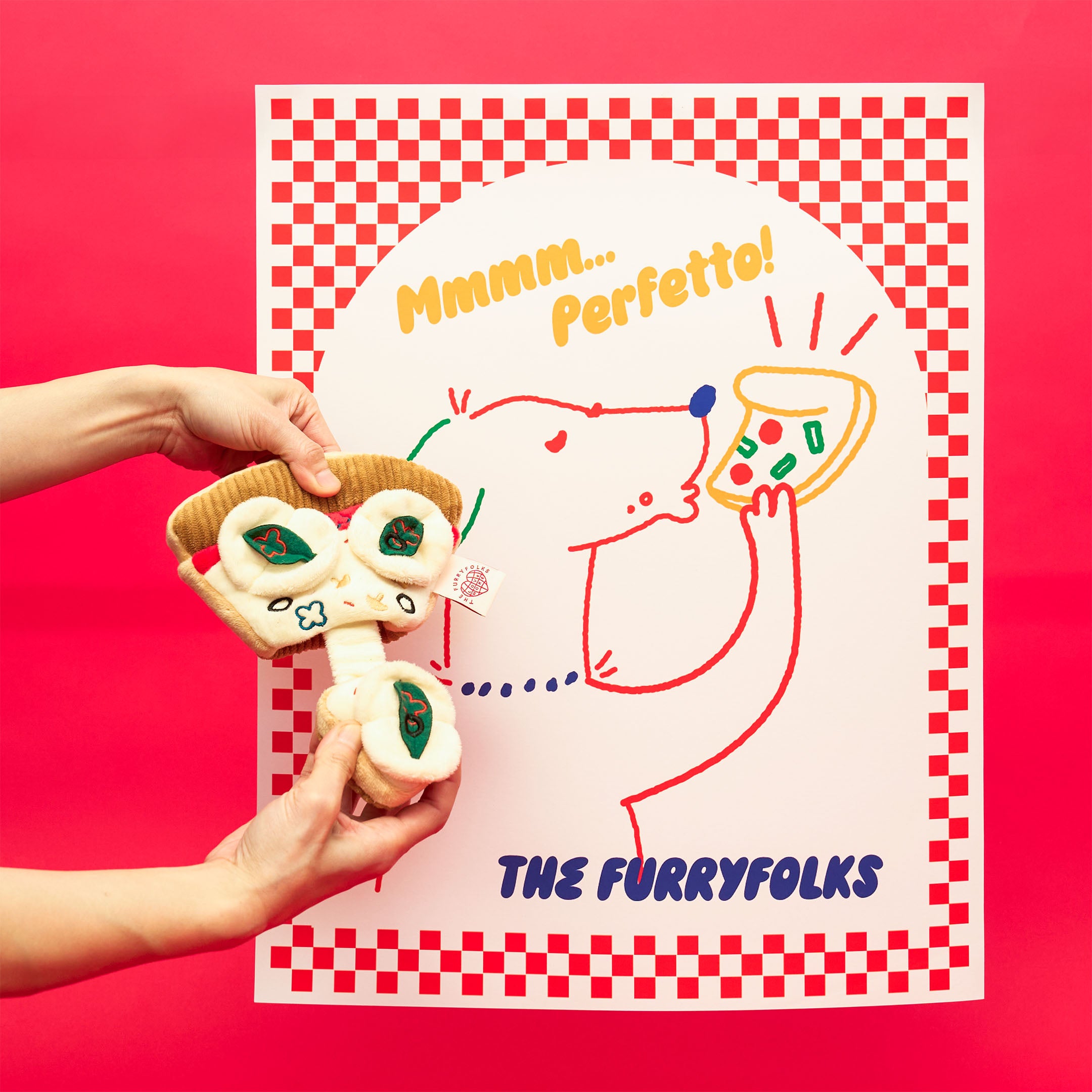 Hands holding a plush pizza slice nosework toy in front of a playful illustrated poster featuring a dog enjoying a slice of pizza. The design captures the fun and charm of the furryfolks’ interactive pet toys.