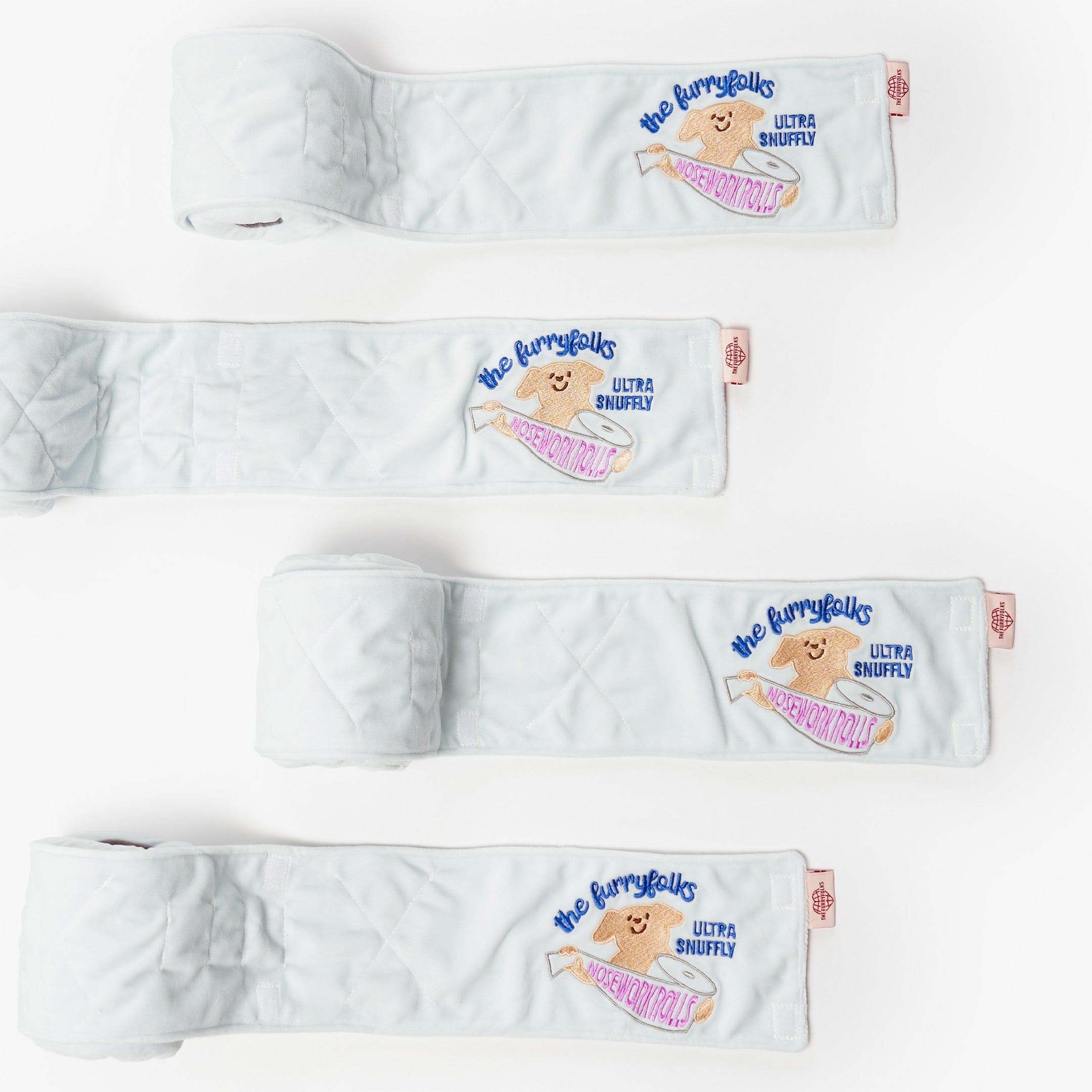 Set of white pet beds with 'The Furryfolks' branding on a white background