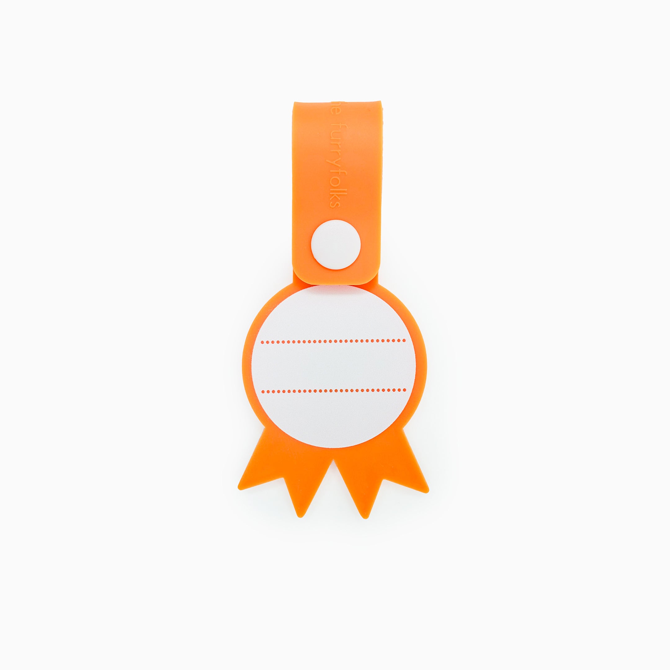 Back view of a dog tag with an orange strap and a white button, featuring a blank white space with dotted lines for writing a pet’s name and contact details. This practical and customizable tag is part of The Furryfolks’ Daily Clip product line, made from 100% non-toxic rubber and designed to be securely attached to a dog leash or collar.