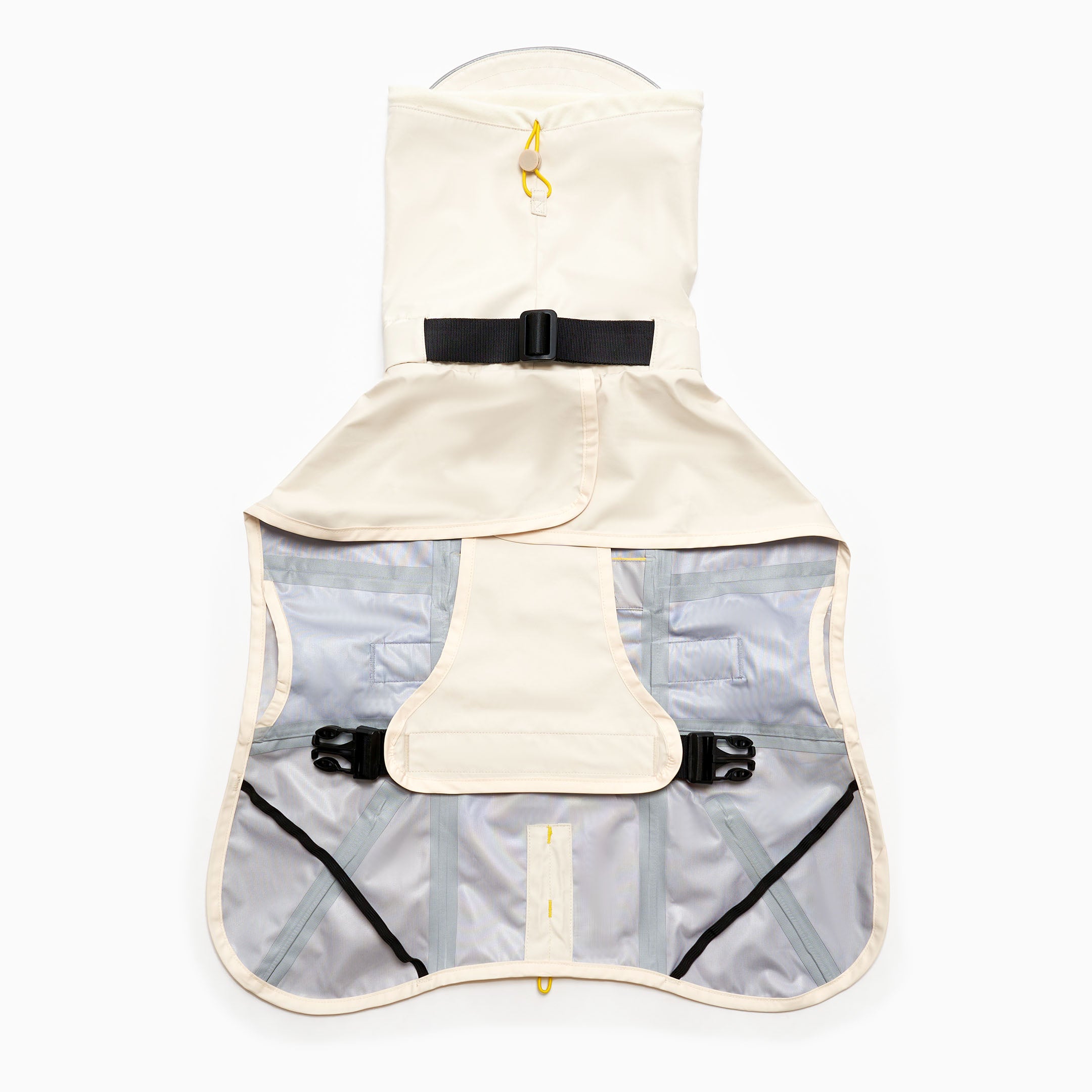  Interior view of a beige and grey dog raincoat featuring waterproof lining, elastic leg straps, and a secure buckle system. The raincoat has a front chest cover for protection and a convenient design for easy movement.